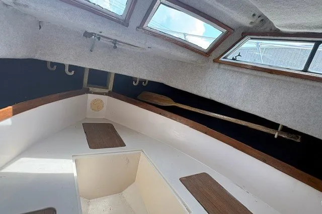 Slide: The Image of Interior cabin of 1987 Grady White 22 Sea Farer boat with wooden accents and windows. - 20