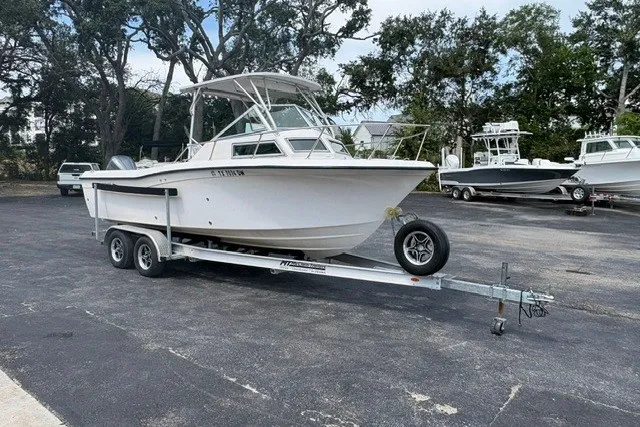 Slide: The Image of 1987 Grady White 22 Sea Farer boat on trailer in parking lot. - 27