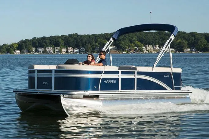 Slide: The Image of Manufacturer Provided Image: 2020 Harris Cruiser 210 pontoon boat cruising on a lake. - 18