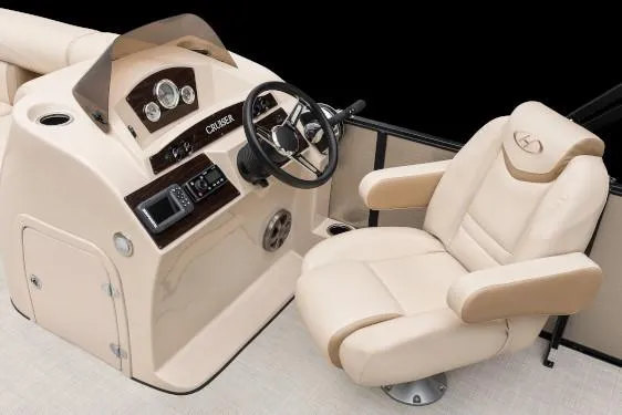Slide: The Image of Manufacturer Provided Image: 2020 Harris Cruiser 210 boat helm with beige captain's chair and control panel. - 23