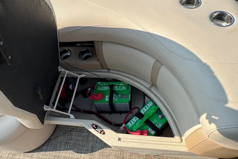 Slide: The Image of Storage compartment of a 2020 Harris Cruiser 210 boat with batteries visible. - 29