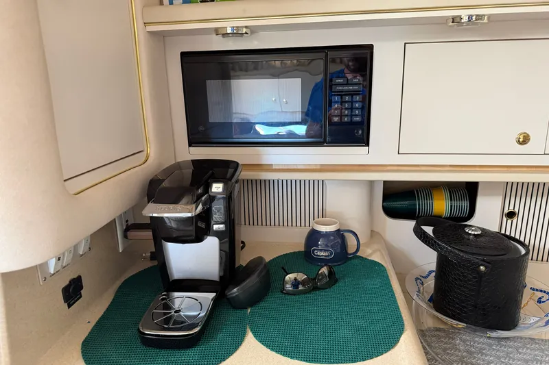 Slide: The Image of Galley area of 2000 Sea Ray 340 Sundancer with microwave and coffee maker. - 15