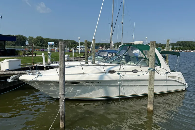 The Image of 2000 Sea Ray 340 Sundancer docked at a marina on a sunny day. - 0
