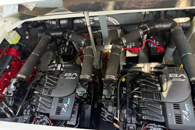 Slide: The Image of The engine room of a 2000 Sea Ray 340 Sundancer features two powerful engines. - 24