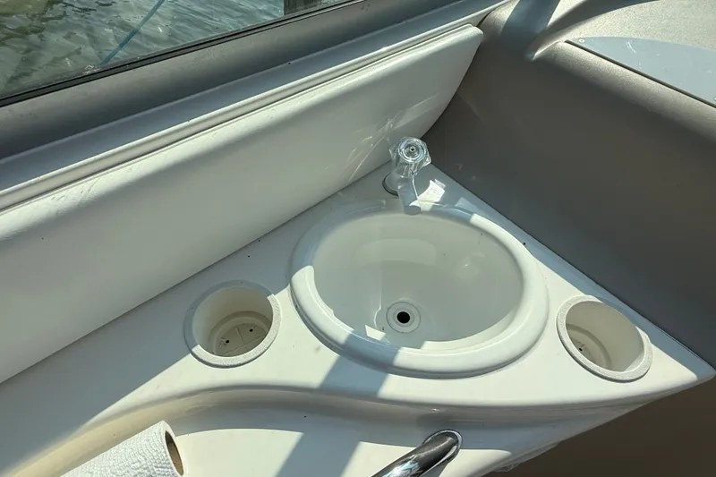Slide: The Image of Cockpit sink area on a 2000 Sea Ray 340 Sundancer boat. - 13