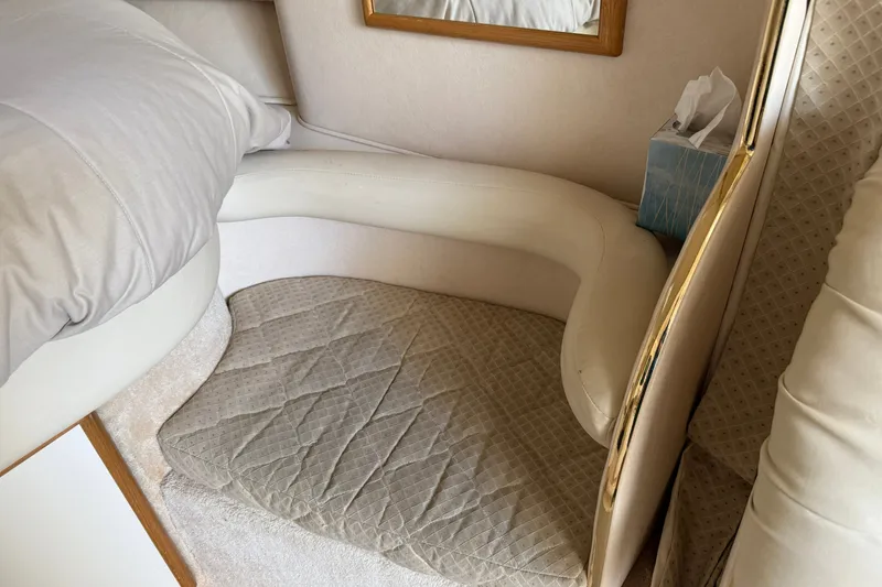 Slide: The Image of Interior seating area of a 2000 Sea Ray 340 Sundancer yacht with beige upholstery. - 20