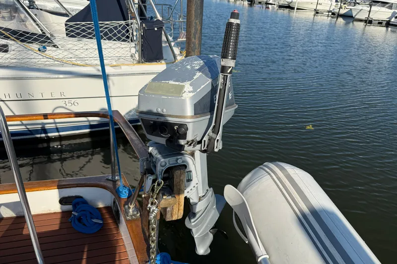 Slide: The Image of Outboard motor on Albin 36 Trawler, 1982, docked near water. - 19