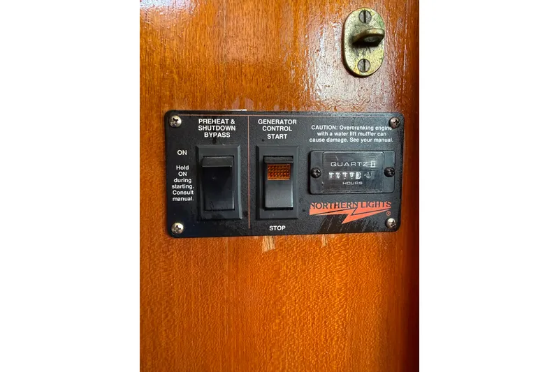 Slide: The Image of Control panel on 1982 Albin 36 Trawler with generator start and preheat switches. - 32