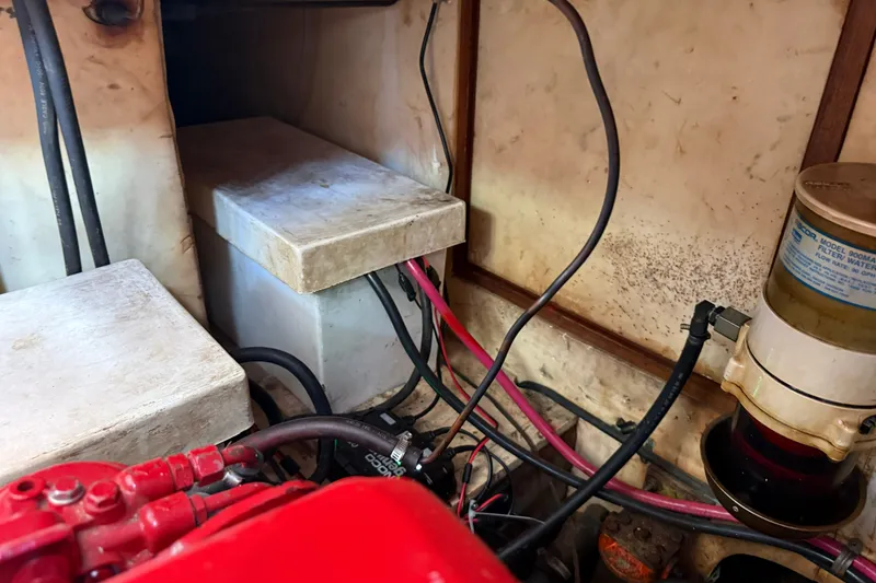 Slide: The Image of Engine compartment of 1982 Albin 36 Trawler with wiring and filter system. - 37