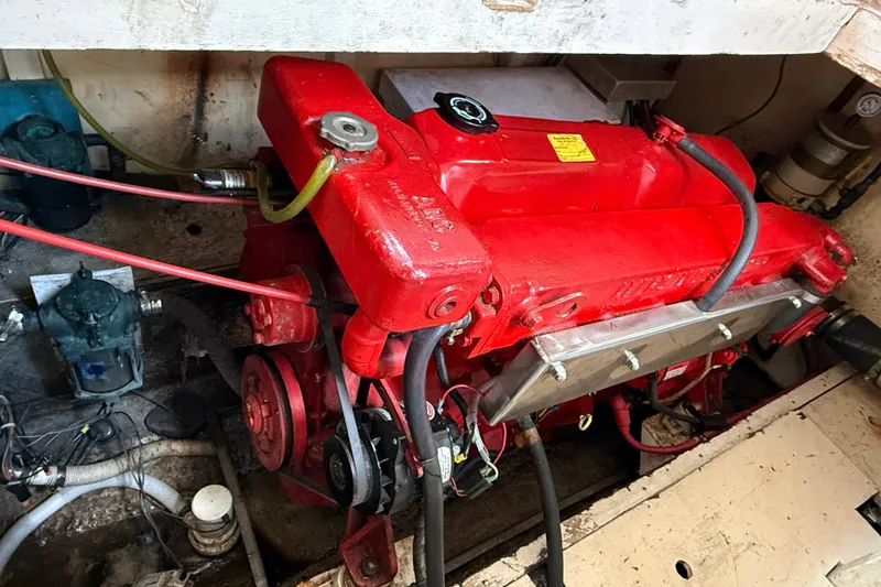 Slide: The Image of Engine compartment of a 1982 Albin 36 Trawler with a red engine. - 34