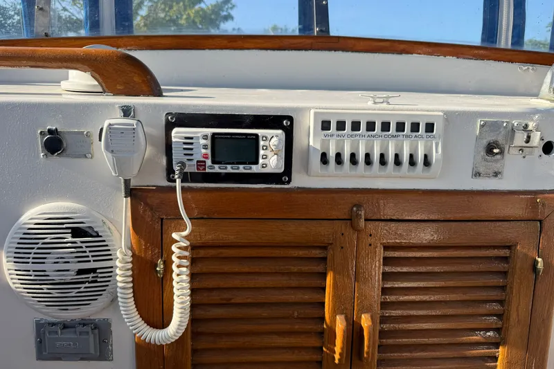 Slide: The Image of 1982 Albin 36 Trawler helm with radio, speaker, and control panel. - 17