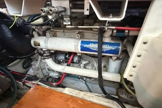 Slide: The Image of Engine compartment of a 1997 Maxum 4100 SCA boat, featuring Diamond Performance Series components. - 37