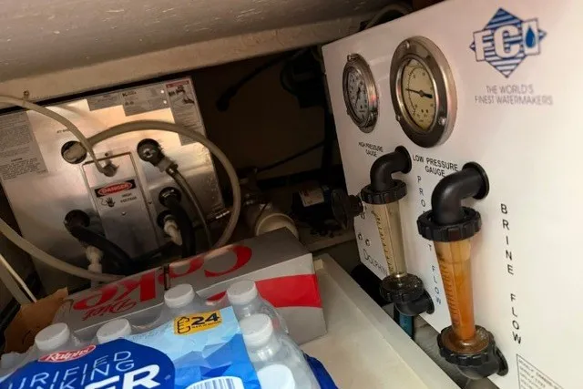 Slide: The Image of Engine room of 1997 Maxum 4100 SCA with watermaker system and beverage storage. - 40