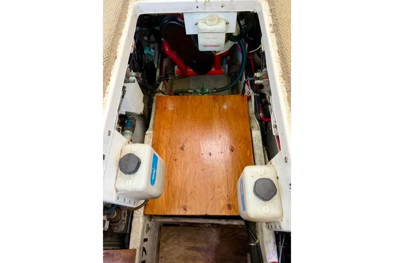 Slide: The Image of Engine compartment of a 1997 Maxum 4100 SCA boat, featuring mechanical components. - 39