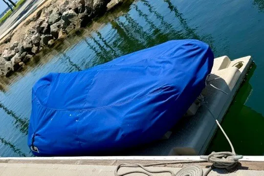 Slide: The Image of Covered Maxum 4100 SCA boat docked, 1997 model, with blue tarp. - 47