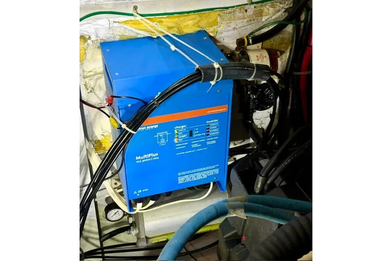 Slide: The Image of Blue MultiPlus inverter in a 1997 Maxum 4100 SCA boat engine room. - 36