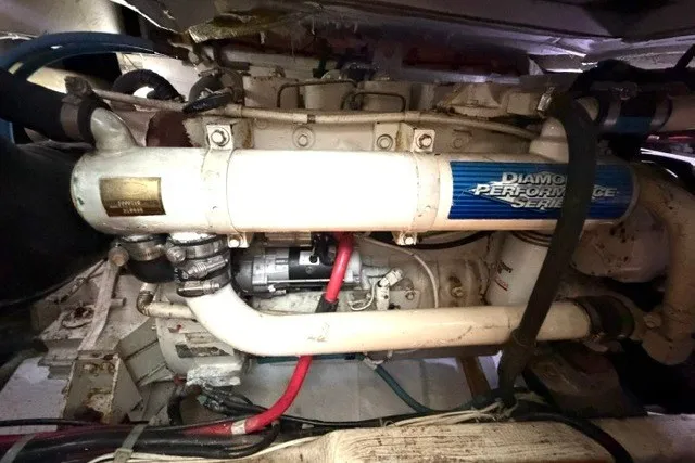 Slide: The Image of Engine compartment of a 1997 Maxum 4100 SCA boat, featuring a Diamond Performance Series engine. - 35