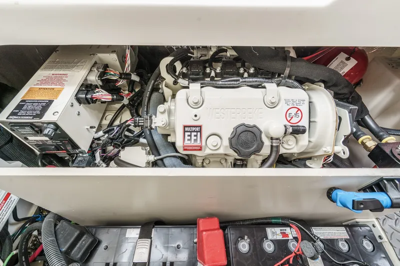 Slide: The Image of The engine compartment features a Westerbeke engine with electronic fuel injection and several batteries. - 38
