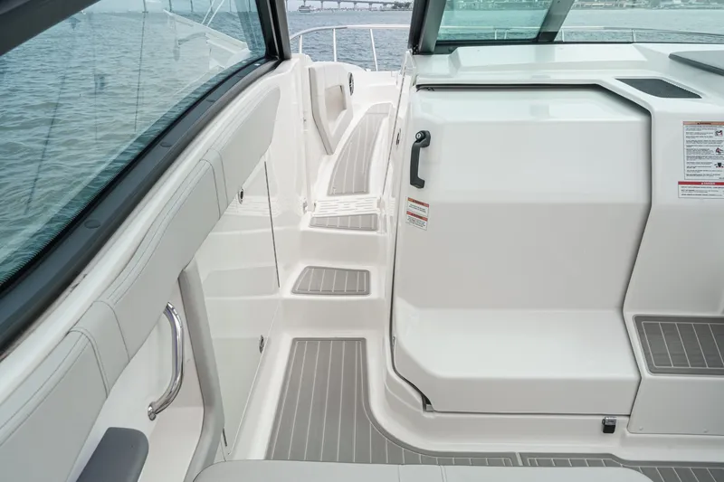 Slide: The Image of The image shows the deck of a 2025 Sea Ray 320 Sundancer DA Coupe with gray accents. - 15