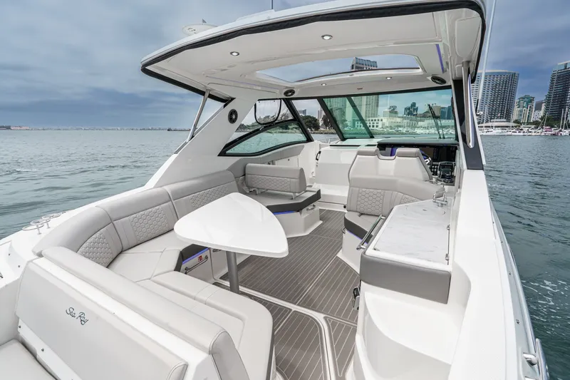 Slide: The Image of The image shows the cockpit of a 2025 Sea Ray 320 Sundancer DA Coupe with luxurious interior. - 3
