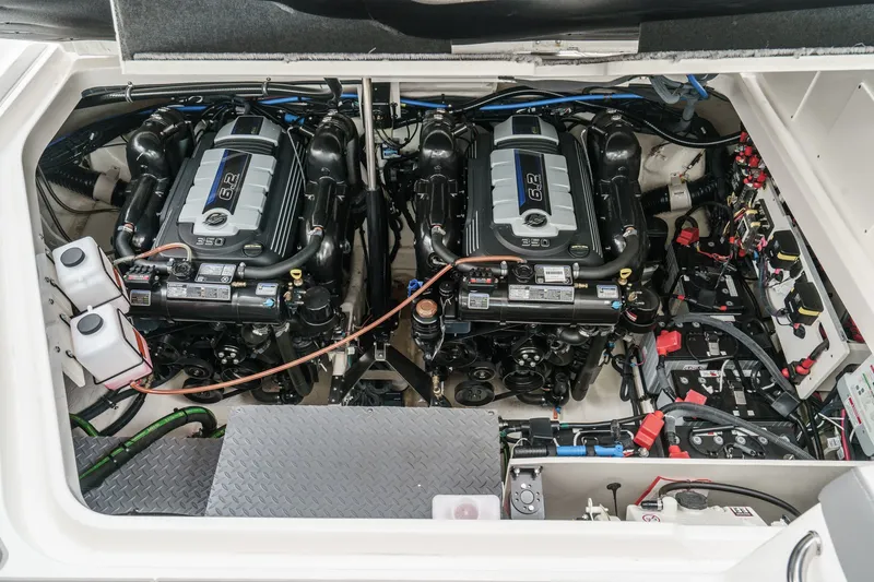 Slide: The Image of The engine room of a 2025 Sea Ray 320 Sundancer DA Coupe features two powerful engines. - 32