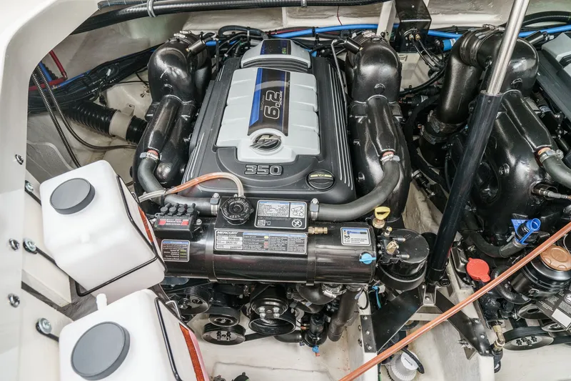 Slide: The Image of The engine compartment of a 2025 Sea Ray 320 Sundancer DA Coupe features a 6.2-liter engine. - 37