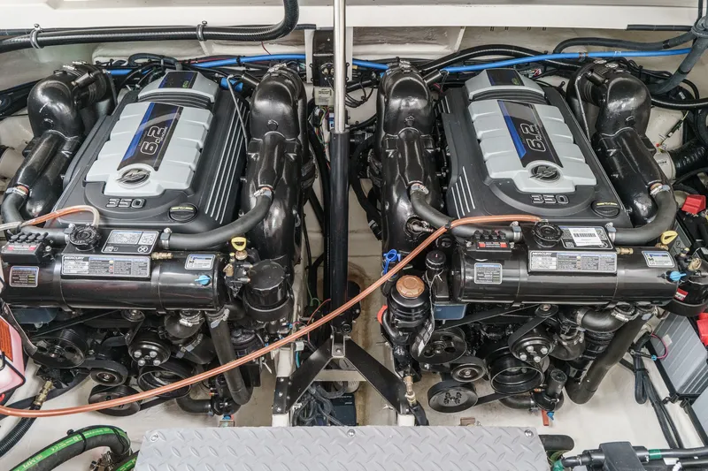 Slide: The Image of Two powerful engines in the engine room of a 2025 Sea Ray 320 Sundancer DA Coupe. - 33