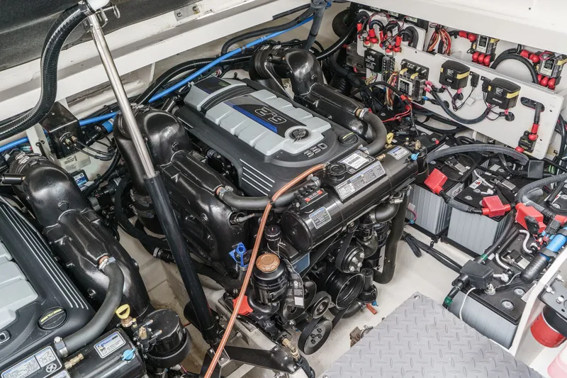 Slide: The Image of The engine room of a 2025 Sea Ray 320 Sundancer DA Coupe features two powerful engines. - 34