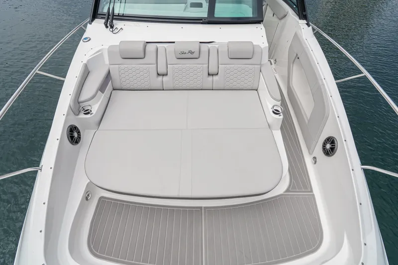 Slide: The Image of The image shows the spacious aft deck of a 2025 Sea Ray 320 Sundancer DA Coupe. - 17