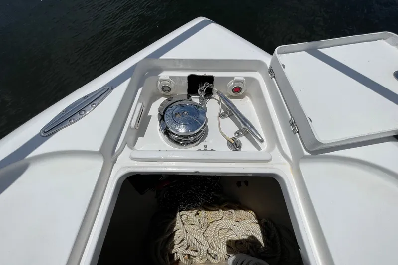 Slide: The Image of Anchor compartment of 2010 Intrepid 390 Sport Yacht with rope storage and winch. - 38