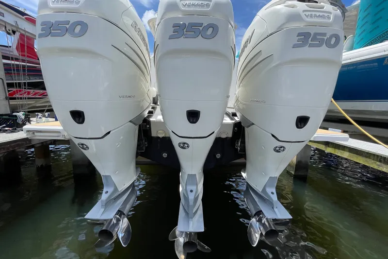 Slide: The Image of Triple Mercury Verado 350 engines on a 2010 Intrepid 390 Sport Yacht at dock. - 43