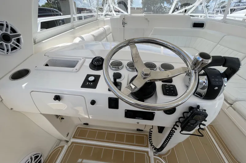 Slide: The Image of Helm of 2010 Intrepid 390 Sport Yacht with steering wheel and controls. - 31