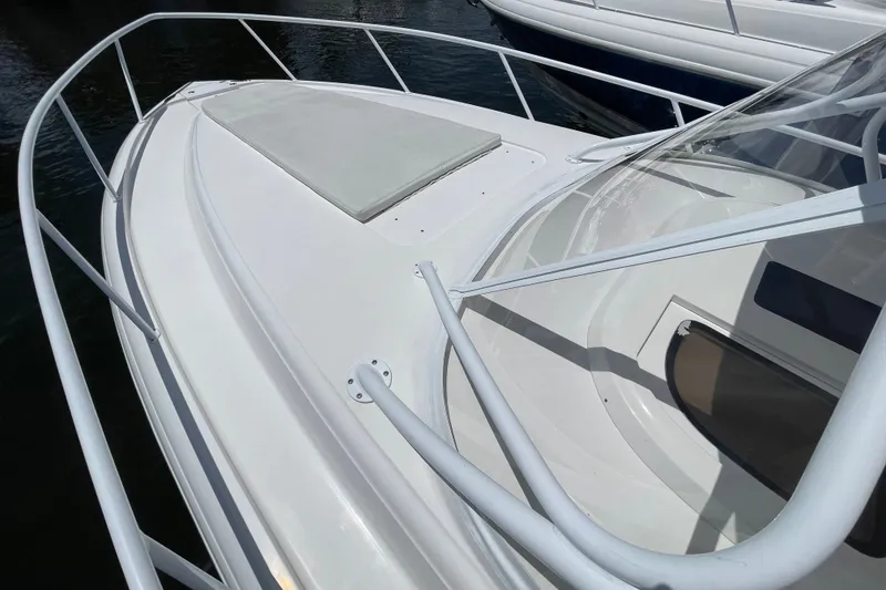 Slide: The Image of 2010 Intrepid 390 Sport Yacht bow with sleek design and railing. - 15