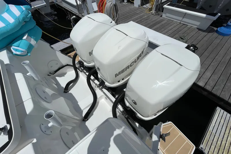 Slide: The Image of Triple Mercury outboard engines on a 2010 Intrepid 390 Sport Yacht at dock. - 39