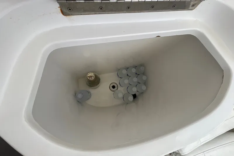 Slide: The Image of Cooler compartment with bottled drinks on a 2010 Intrepid 390 Sport Yacht. - 37
