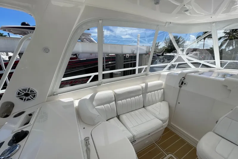 Slide: The Image of 2010 Intrepid 390 Sport Yacht interior with white seating and sleek design. - 35
