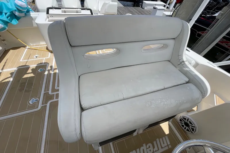 Slide: The Image of White seating on 2010 Intrepid 390 Sport Yacht deck, showcasing luxury marine design. - 27