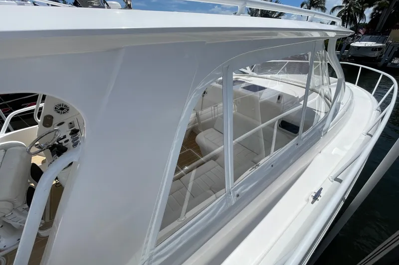 Slide: The Image of 2010 Intrepid 390 Sport Yacht with sleek white design and spacious cockpit area. - 28