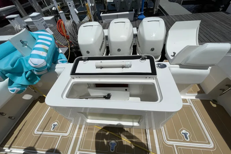 Slide: The Image of 2010 Intrepid 390 Sport Yacht with triple outboard engines and deck storage. - 19