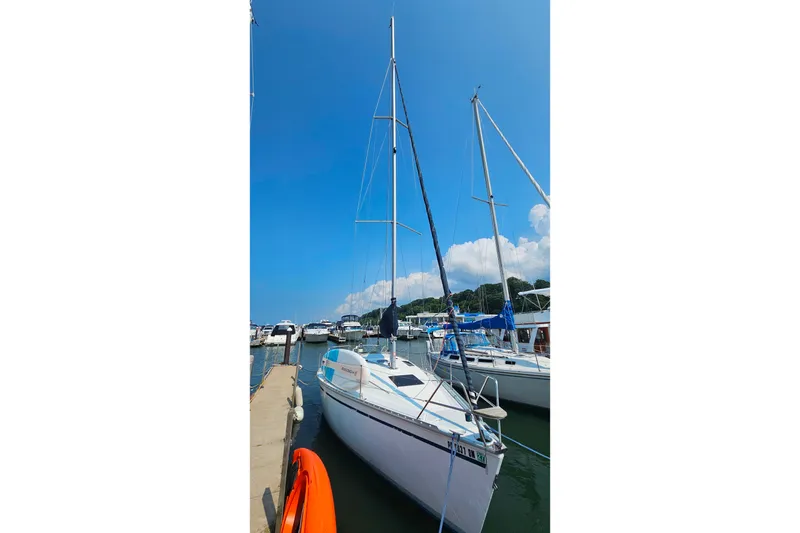 Slide: The Image of Sailboat docked at marina, Hunter 30 model, 1989, under clear blue sky. - 4