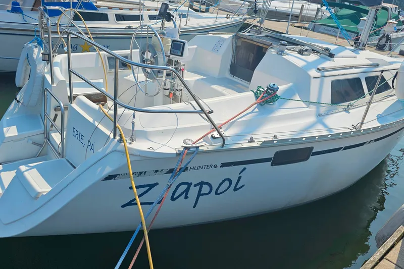 Slide: The Image of 1989 Hunter 30 sailboat named "Zapoi" docked in Erie, PA marina. - 7