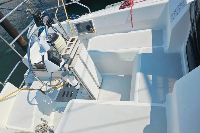 Slide: The Image of Cockpit of a 1989 Hunter 30 sailboat with steering wheel and navigation equipment. - 9