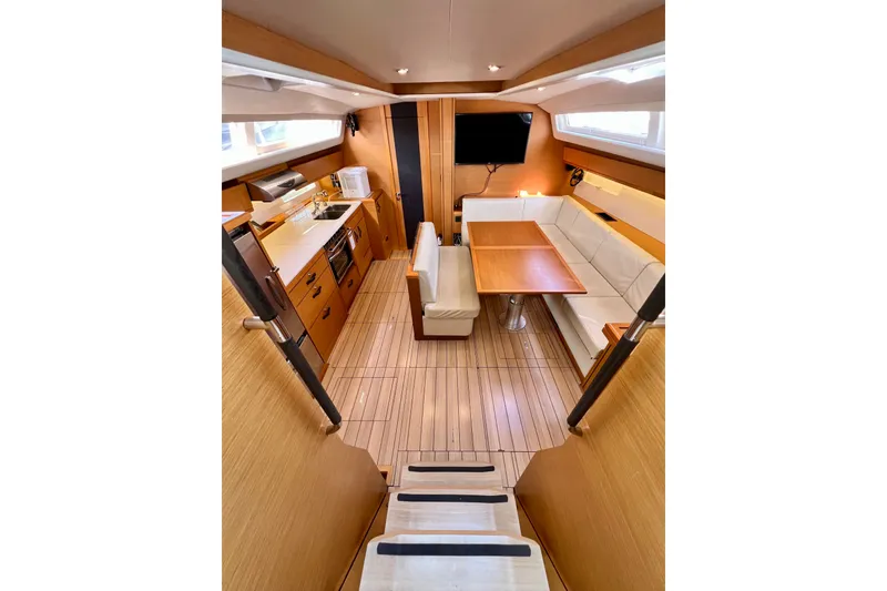 Slide: The Image of Luxurious interior of 2018 Jeanneau 54 yacht with modern kitchen and seating area. - 41