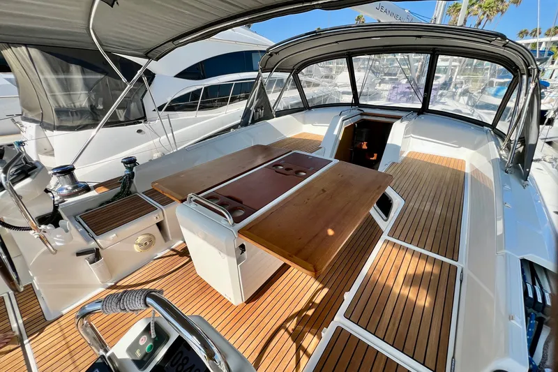 Slide: The Image of 2018 Jeanneau 54 yacht cockpit with teak flooring and foldable table. - 29