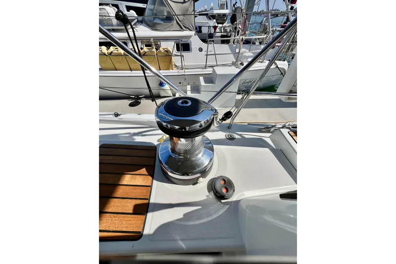 Slide: The Image of Deck of 2018 Jeanneau 54 sailboat featuring winch and teak accents. - 36