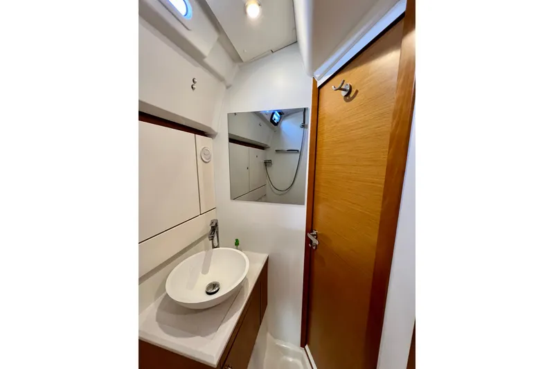 Slide: The Image of Modern bathroom interior of 2018 Jeanneau 54 yacht with sink and mirror. - 88