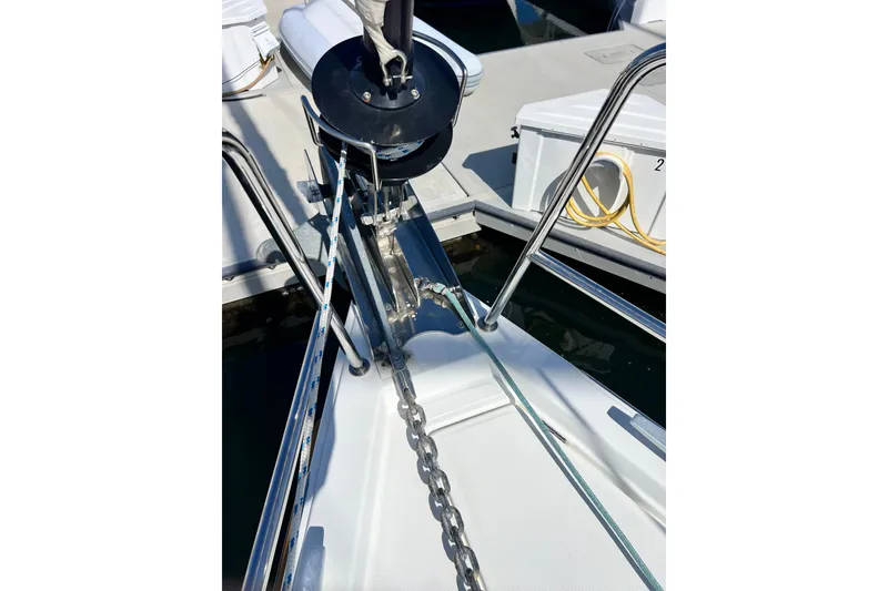 Slide: The Image of Bow of 2018 Jeanneau 54 yacht with anchor chain and winch system. - 16