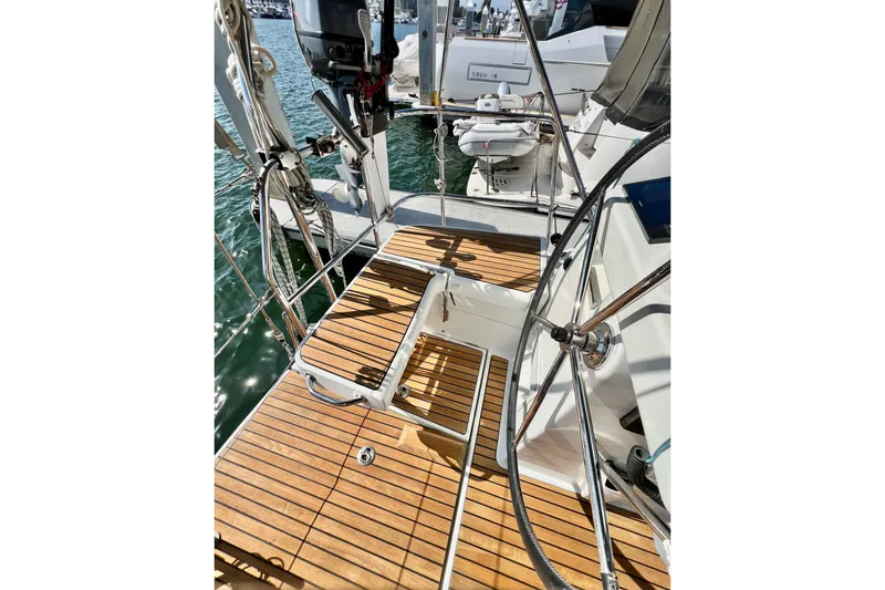 Slide: The Image of 2018 Jeanneau 54 yacht deck with teak flooring and stainless steel fittings. - 38