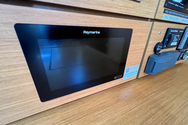 Slide: The Image of Raymarine display panel on 2018 Jeanneau 54 yacht's wooden dashboard. - 63