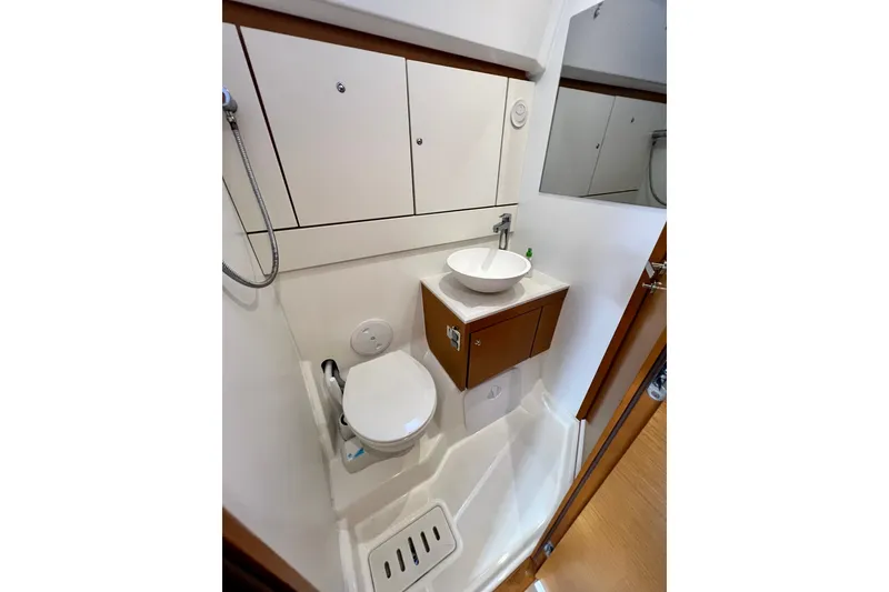 Slide: The Image of Compact bathroom in a 2018 Jeanneau 54 yacht, featuring modern fixtures and efficient design. - 89